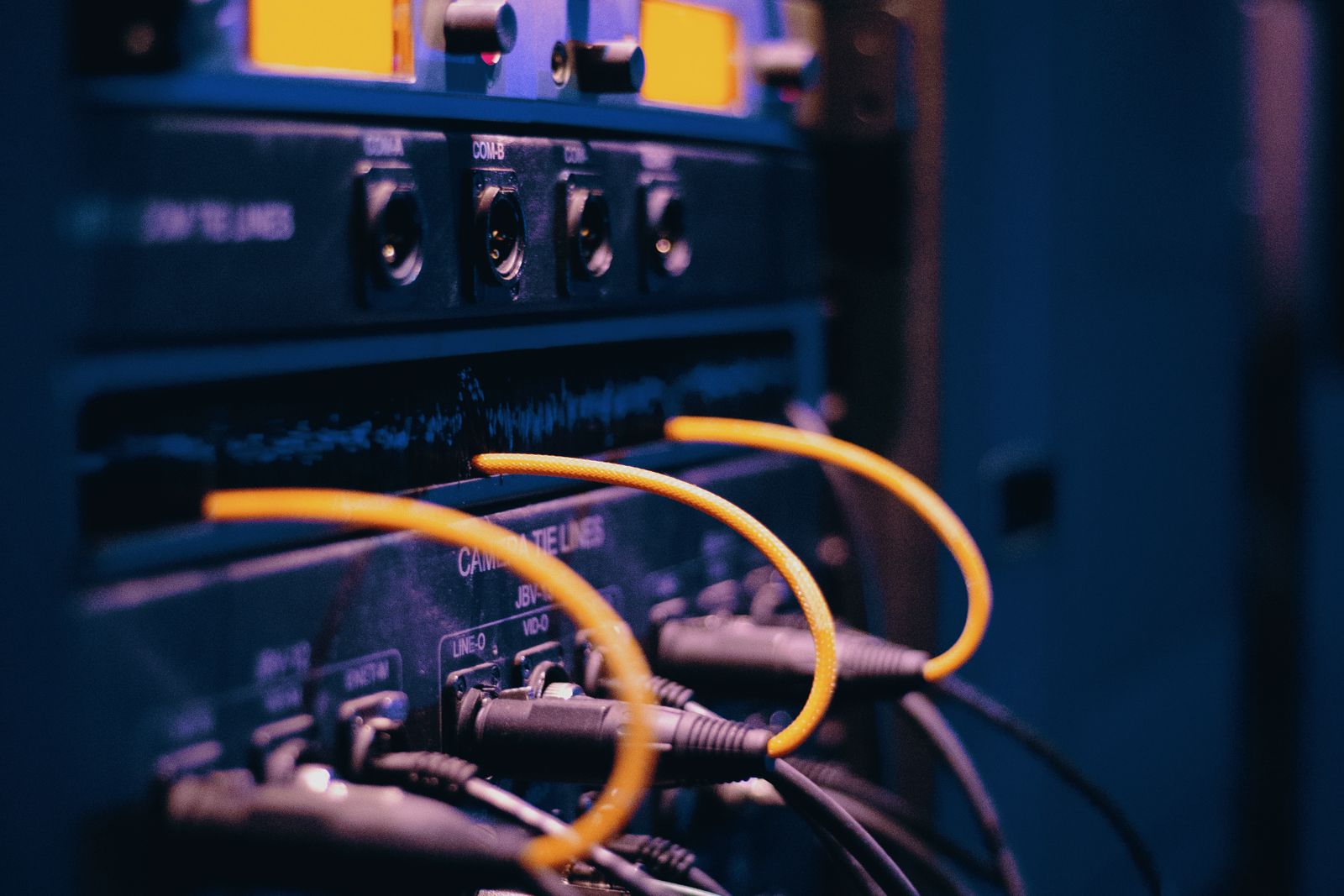 Network cables connected to telecommunications equipment.
